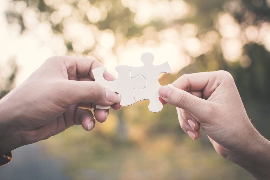 hand-holding-model-house-bokeh-background