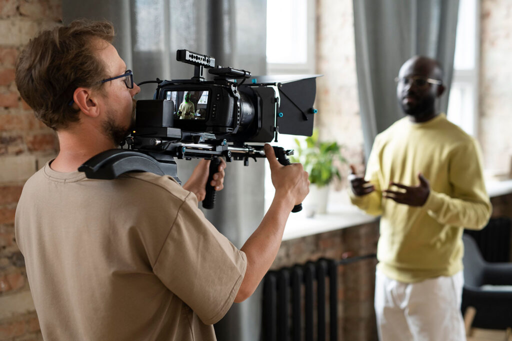 man-filming-with-professional-camera-new-movie