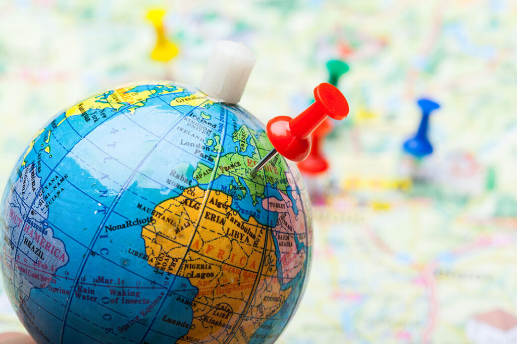colorful-pins-marking-destinations-on-a-globe-2026-09-23-18-59-20-utc